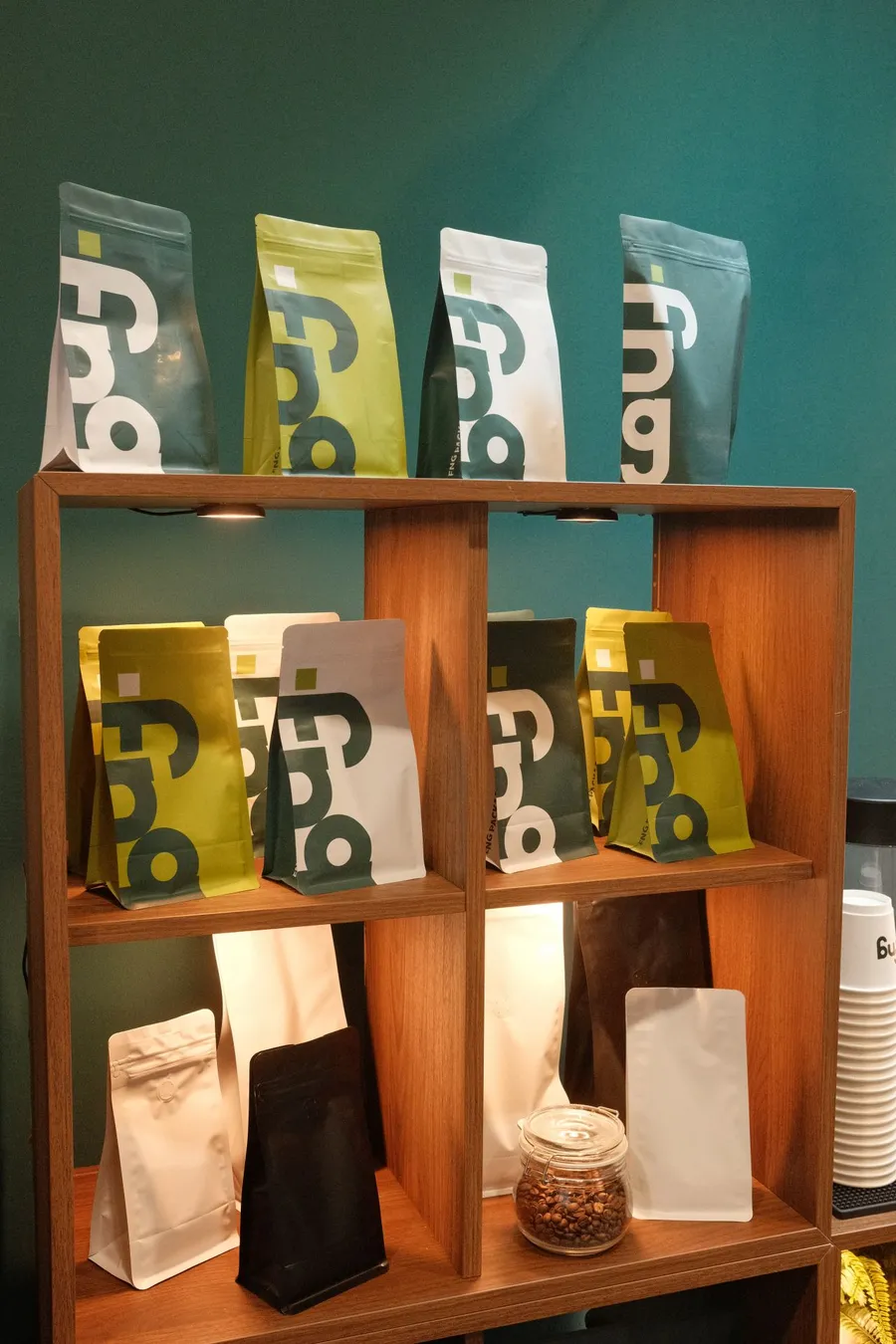 FNG-printed coffee pouches on the booth shelf