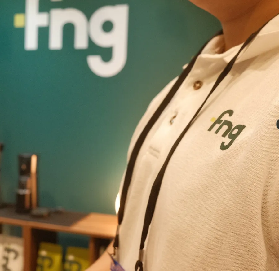 An FNG-branded polo shirt at the FNG booth